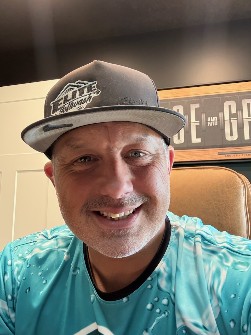 Brandon Metzger, owner of Elite Christmas Lights, in his Elite crew hat